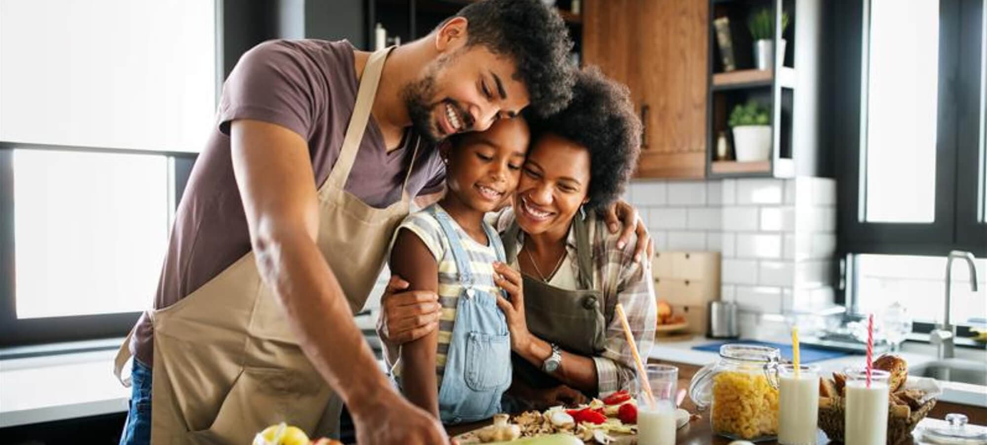 family preparing food in kitchen